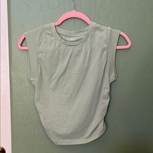 Sleeveless light green muscle tank